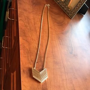 Long gold colored necklace